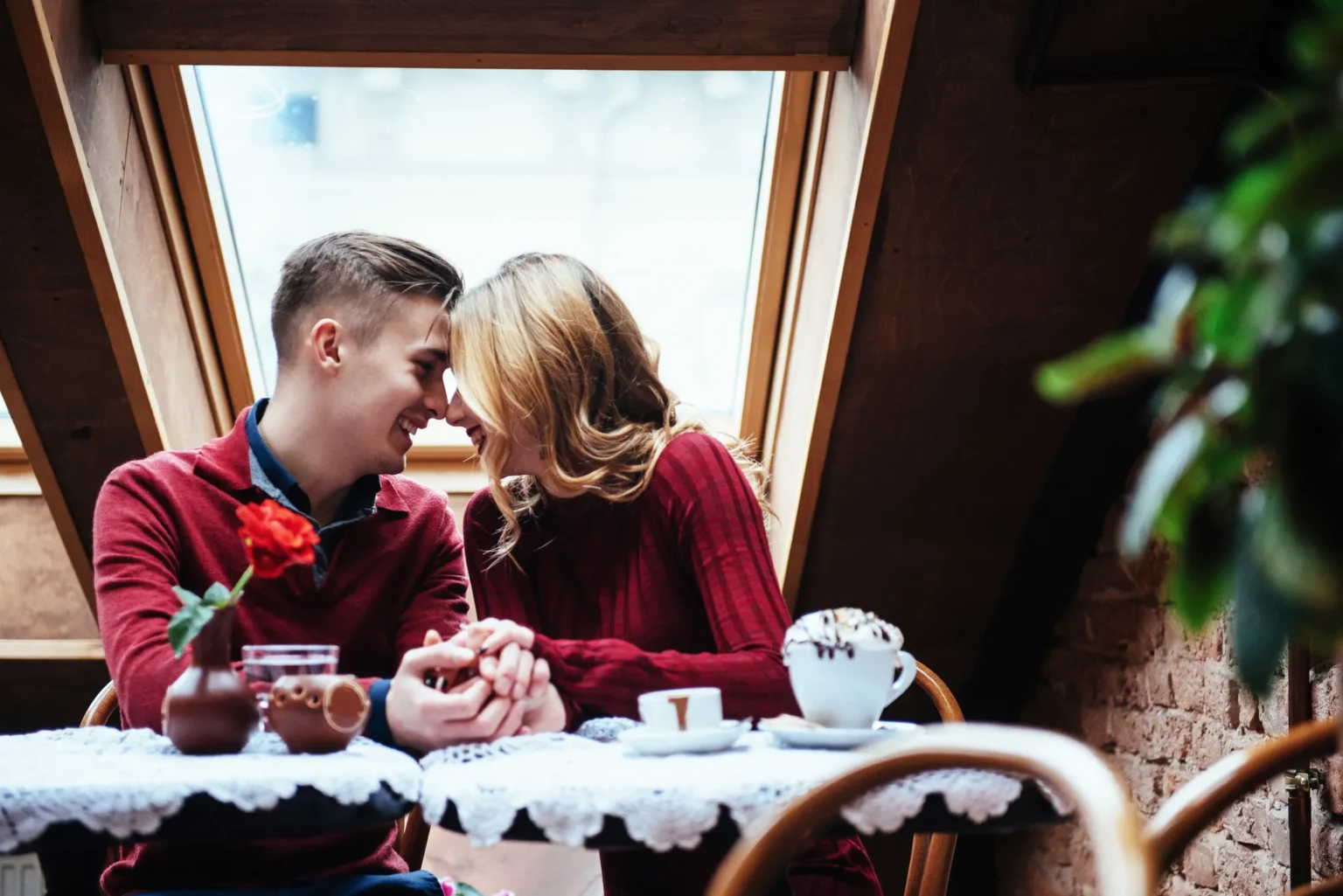 Couple sharing coffee at a café table