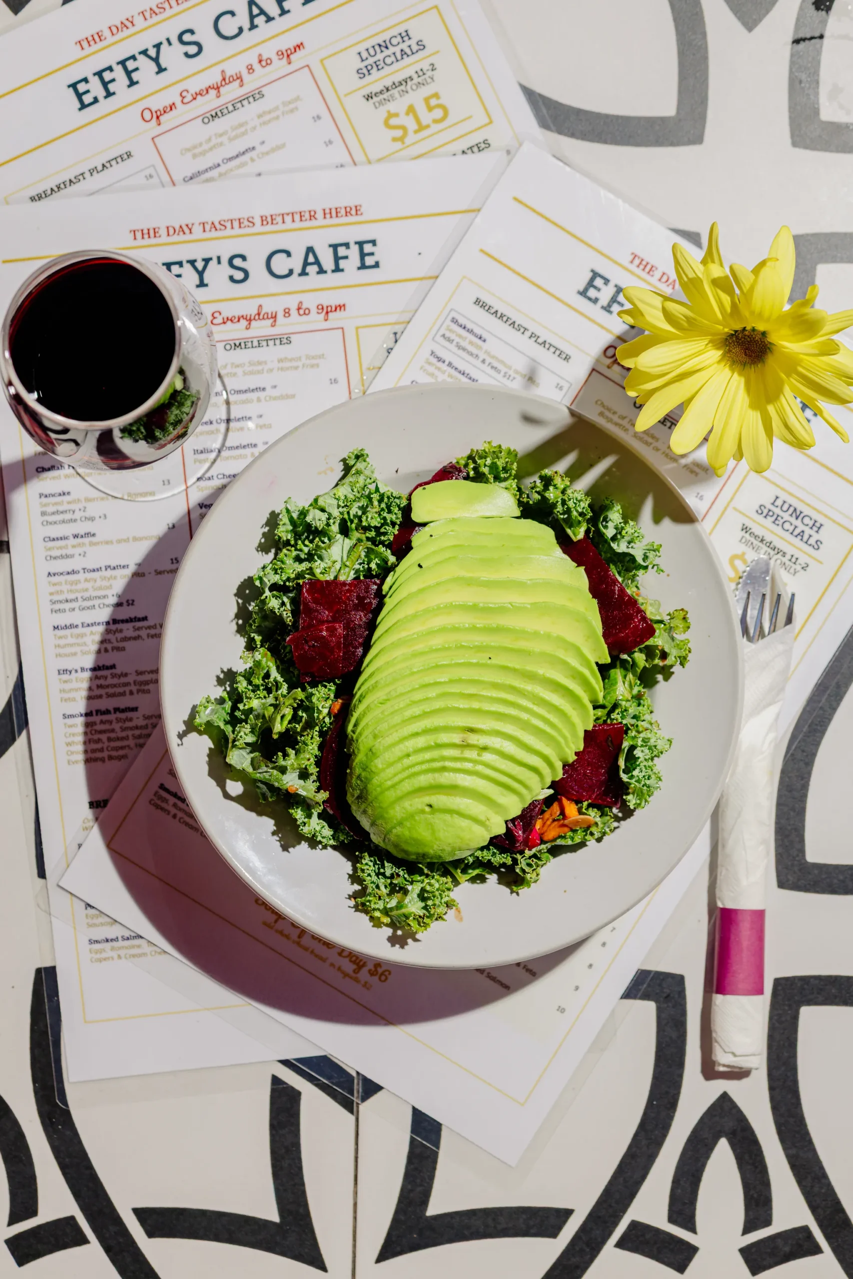 Kale and beet salad topped with avocado at Effy’s Café