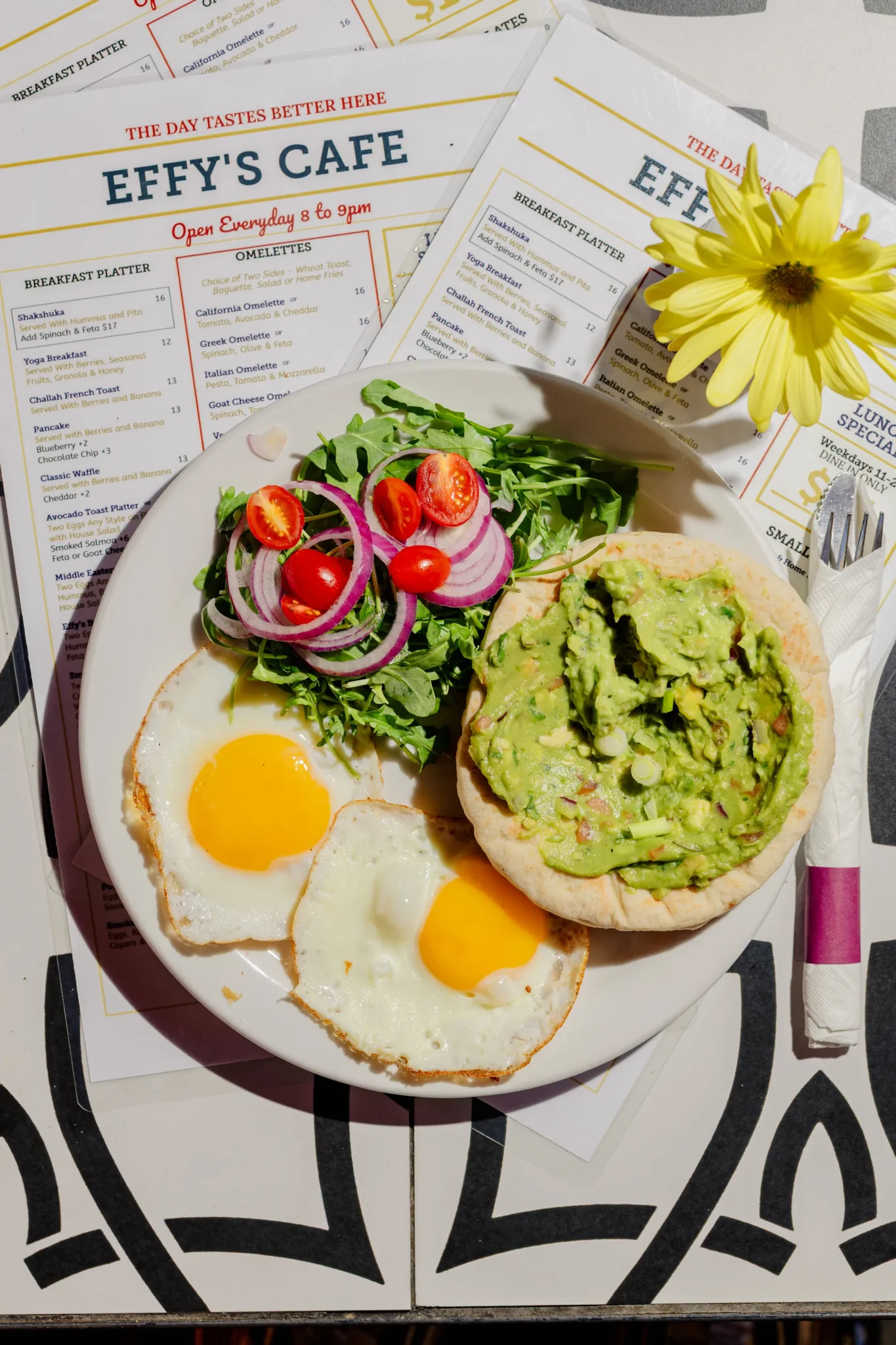 Avocado toast with fried eggs and salad at Effy’s Café