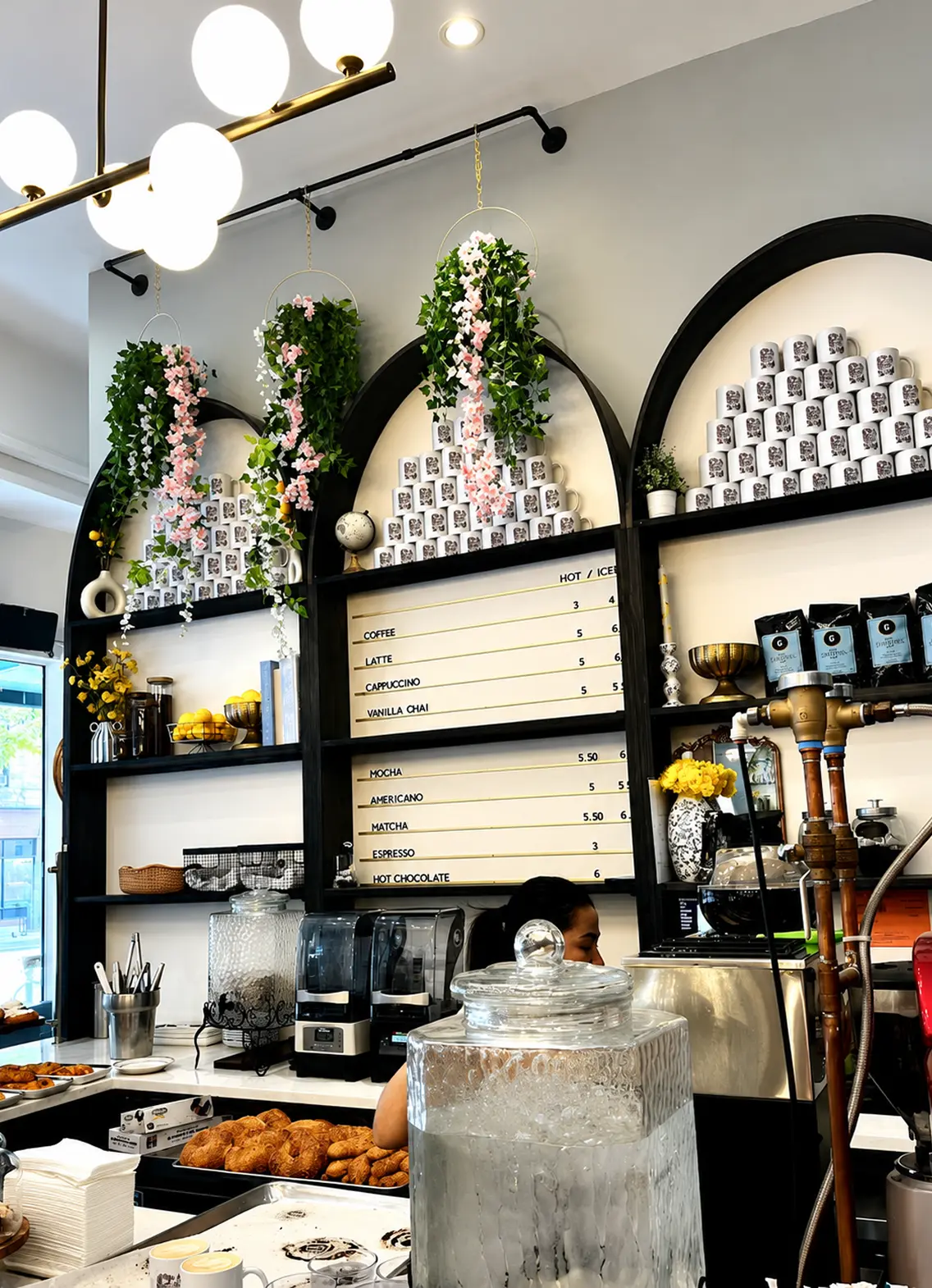 Interior of Effy’s Café with arched shelves and a menu board