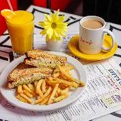 Sandwich and fries with coffee and orange juice at Effy’s Café