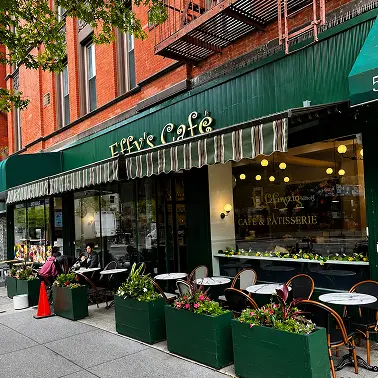 Effy’s Café exterior with green awnings and outdoor seating