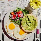 Avocado toast with fried eggs and salad at Effy’s Café