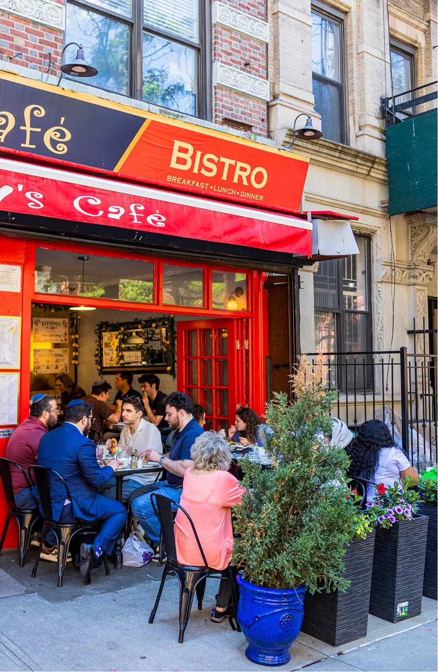 Guests dining at the outdoor seating area of Effy’s Café in Manhattan