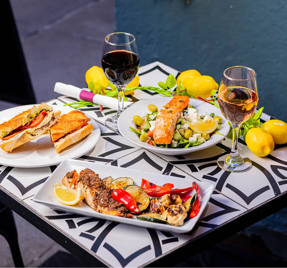Grilled salmon salad, roasted vegetables, sandwiches, and wine at Effy’s Café